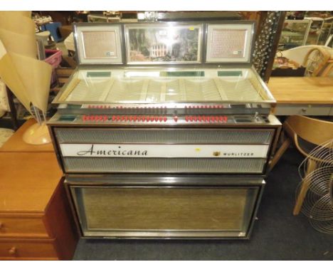 A 1960S WURLITZER AMERICANA 3100 JUKEBOX - 80 PLAYS ON 7" SINGLE RECORDS CONVERTED TO 240v MAINS ELECTRICITY, WITH KEYS AND O