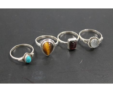 A COLLECTION OF 4 VINTAGE 925 SILVER GEMSTONE DRESS RINGS TO INCLUDE TIGERS EYE, OPAL, GARNET ETC