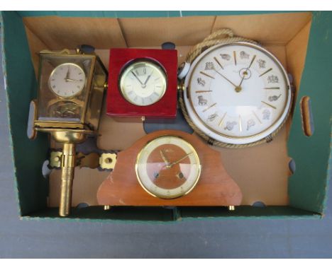 A TRAY CONTAINING A KIENZLE ZODIAC WALL CLOCK, QUARTZ NAUTICAL CLOCK, MANTLE CLOCK AND A SHATZ BRACKET MOUNTED ANNIVERSARY CL