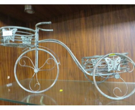 A METAL NOVELTY BIKE PLANTER 