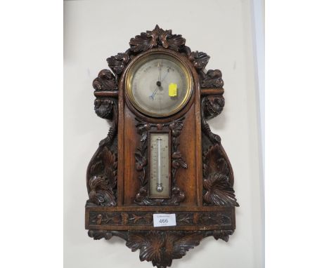 AN ANTIQUE HEAVILY CARVED WALL BAROMETER A/F 