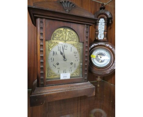 A VINTAGE MAHOGANY MANTLE CLOCK TOGETHER WITH AN ORNATE WALL MOUNTED BAROMETER  