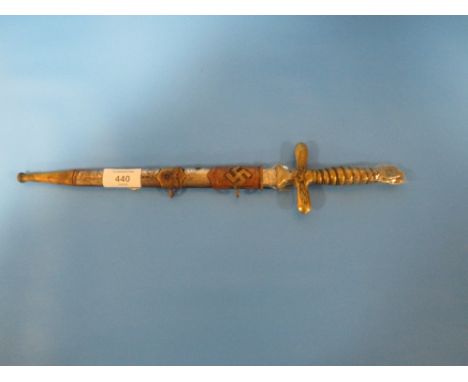 A GERMAN THIRD REICH STYLE DAGGER WITH EAGLE TO CROSS GUARD AND POMMEL IN STEEL, SCABBARD WITH GOTHIC SCRIPT ENGRAVED TO THE 
