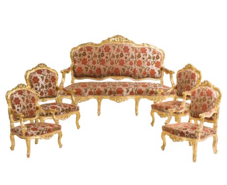 A five-piece salon in carved and gilt wood with floral upholstery, 19th/20th C.H 132 x L 190 x D 68 cm (the sofa)H 120 x L 75