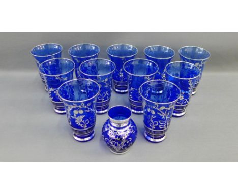 Set of eleven blue and silver lustre glass beakers, together with a similar bud vase, (12) 
