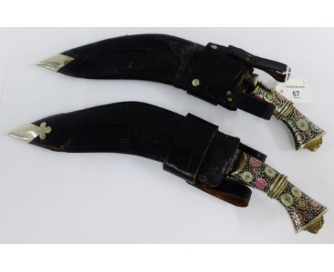 Two Eastern style Kukri daggers with leather sheaf's and enamel work to the handles (2)  