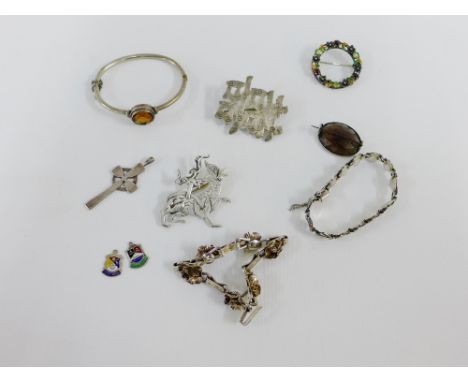A collection of silver and white metal jewellery to include brooches, bangle, bracelets and Iona style cross etc (a lot) 