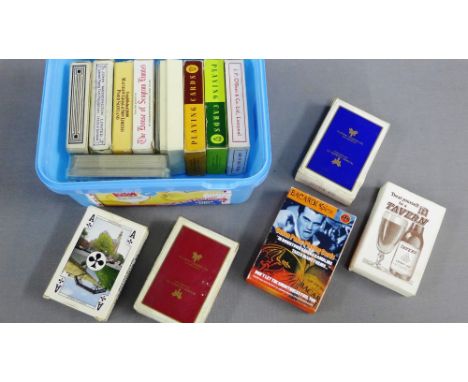 Carton containing a collection of vintage playing cards 