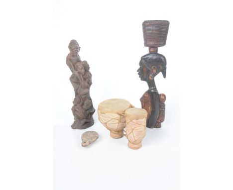 A collection of African collectable items To include a twin terracotta and skin topped drum, 15cm high, a small clay oil lamp