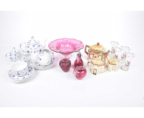 Collection of cranberry glass and two tea servicesTo include a cranberry glass bowl, cranberry strawberry fruit, pear and app