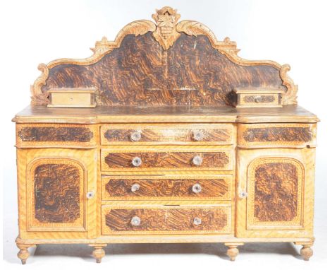 A Victorian pine and scumbled pine kitchen dresser baseThe raised arched back centered with a leaf and fruit crest above two 