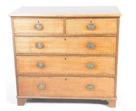A 19th Century mahogany chest of drawers With a rectangular cross banded top above two short and three long graduated drawers
