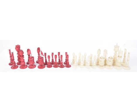 An export ivory carved and stained chess set The full set of thirty-two pieces, each surmounted by a figural head and carved 