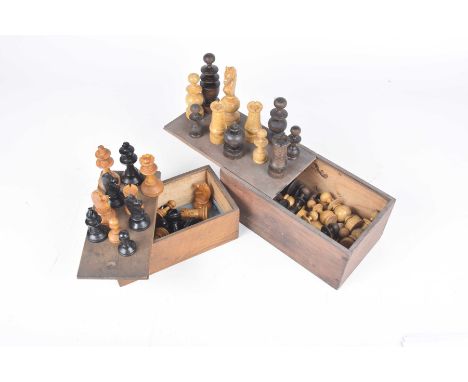 Two carved wooden chess sets/early to mid 20th century Each set housed in a wooden box.