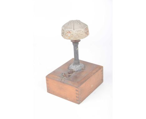 An usual battery operated glass shaded table lamp, early 20th century The moulded glass with painted decoration, mounted on a