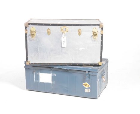 Two vintage travel trunksThe first trunk with an alloy exterior, clasp locks and side handles and a painted metal trunk with 