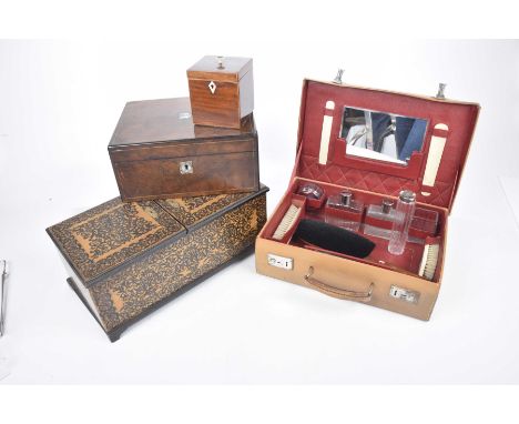 A pig skin vanity case, mid 20th CenturyThe case opens to reveal fitted interior with mirror, brushes, bottles etc., George I