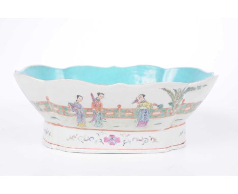 A Chinese famille rose pedestal dish, Jaiqing seal mark, (1796-1820) The pedestal bowl, rising from a high scalloped foot, wi