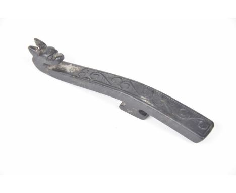 A Chinese carved hard stone belt hook the terminal formed as a qilin head, the sloped hook with button back, 13cm long 