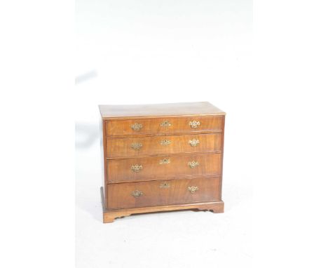 A 19th Century mahogany chest of drawersHaving four graduated cock beaded drawers each applied with brass openwork backplates