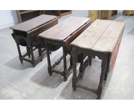 Three 17th / 18th Century oval oak drop leaf dining tablesOn baluster and bobbin turned supports with bun feet (distressed), 