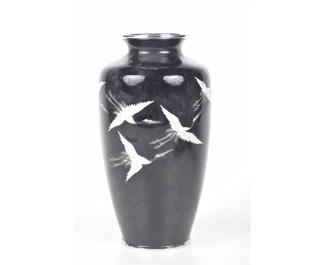 A Japanese cloisonne 'crane' vase, first half 20th centuryOf rounded ovoid form, the mirrored black ground, detailed in grey 