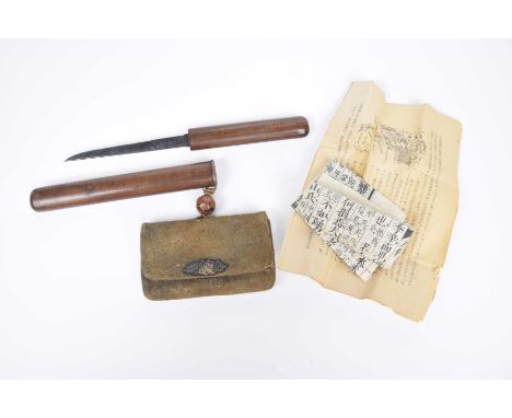 A Japanese Sagemono, early 20th century.  The suede leather dyed purse (for tobacco or money) with lacquered ball finial and 