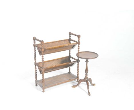 An early 20th Century two tier oak book trough and a wine tableThe freestanding book trough with barley twist uprights suppor