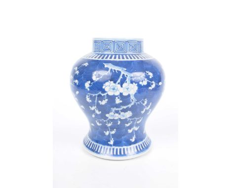A Chinese blue and white 'Prunus' jar, with Kangxi (1654-1722) character marks, 19th centuryOf rounded bulbous form, the rich