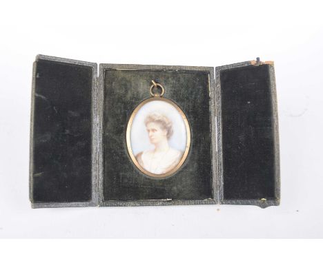 An early 20th Century gilt framed miniatureThe oval miniature depicting a portrait head and shoulders of a middle aged woman 