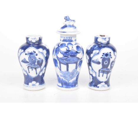 A group of Chinese blue and white vases To include a pair decorated in the Kangxi style with blossom and fan shaped panels, 1