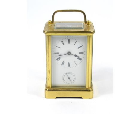 CARRIAGE CLOCK WITH A WHITE ENAMELLED DIAL ENCLOSING AN EIGHT DAY ALARM MOVEMENT STRIKING ON A BELL, IN A BRASS CASE, (H. 12 