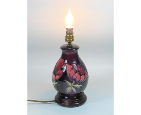 A MOORCROFT POTTERY LAMP BASE, CIRCA 1990'S, OF BALUSTER FORM, TUBELINED AND PAINTED WITH THE 'ANEMONE' PATTERN, ON A STEPPED