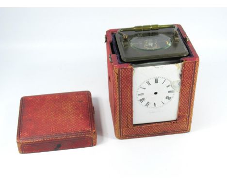 CARRIAGE CLOCK WITH A WHITE ENAMELLED DIAL ENCLOSING AN EIGHT DAY MOVEMENT STRIKING ON A COILED GONG IN A BRASS CASE (H.14.5 