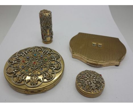 A compact, lipstick and rouge pot set and a Stratton compact