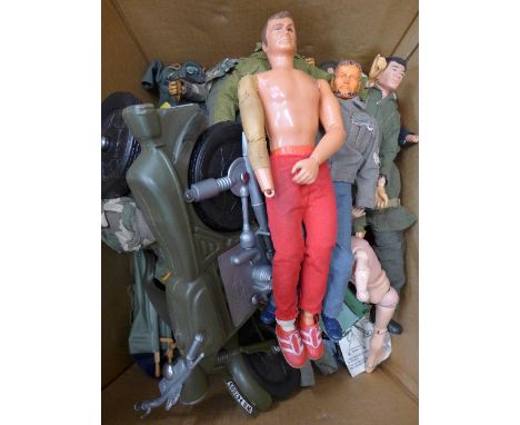 A collection of eleven Action Man figures, clothing and other action figures