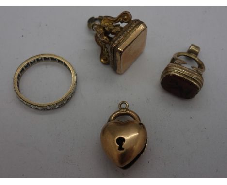 A 15ct gold lock fastener, a/f, two fobs and a ring