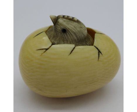 An egg with chick netsuke