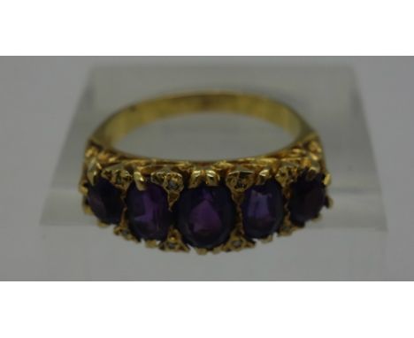 A 9ct gold and purple stone ring, weight 4.8g, size Q