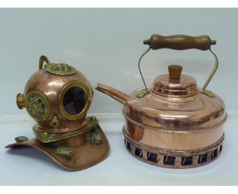 A copper kettle and a diver's helmet