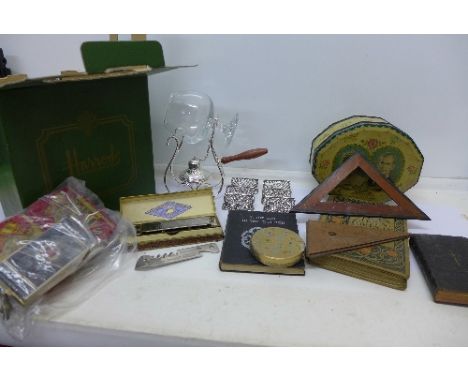 A Hohner harmonica, compacts, tins, books, etc.