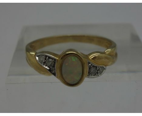 A 9ct gold, opal and diamond ring, weight 2.1g, size O