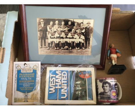 West Ham Football Memorabilia Box: Breedon Complete Record Book, Bobby Moore Mettoy figure, 1923 Cup Final framed replica tea