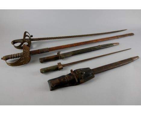 George V officer's sword in leather scabbard, another sword, 1907 British bayonet in leather sheath, and two others, (5),.   