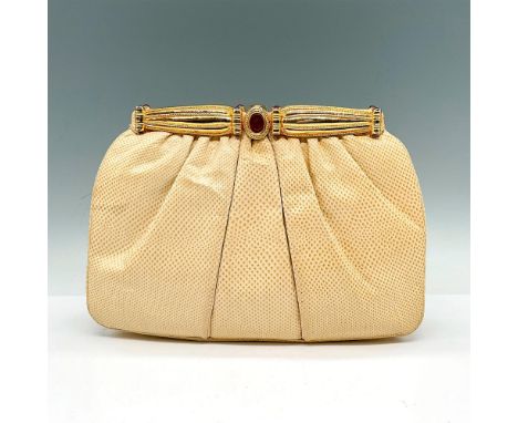 A beautiful vintage bag in a classic shape with rounded corners, softly gathered leather. Delicately constructed and detailed