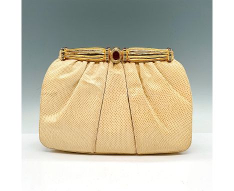 A beautiful vintage bag in a classic shape with rounded corners, softly gathered leather. Delicately constructed and detailed