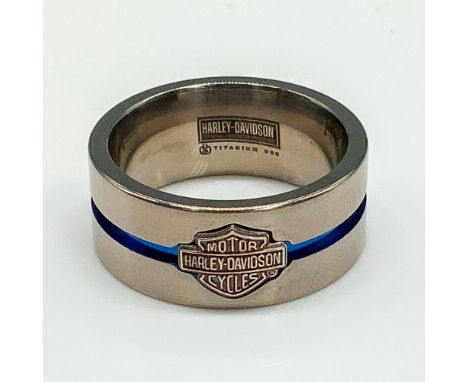 Satin titanium band with a silver Harley Davidson logo and thin blue channel stripe around the middle. Titanium and 925 stamp