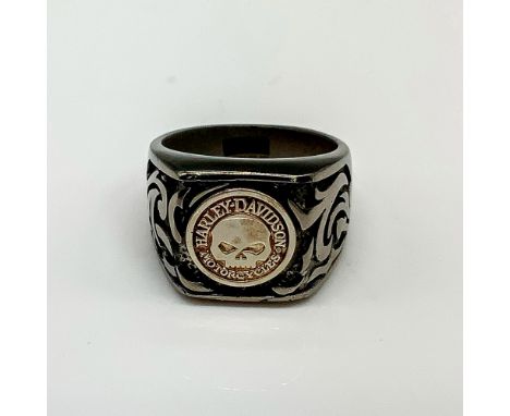 Chunky band with skull emblem and carved flames on either side. Titanium and 925 stamped inside band. Size 12. Condition: Age