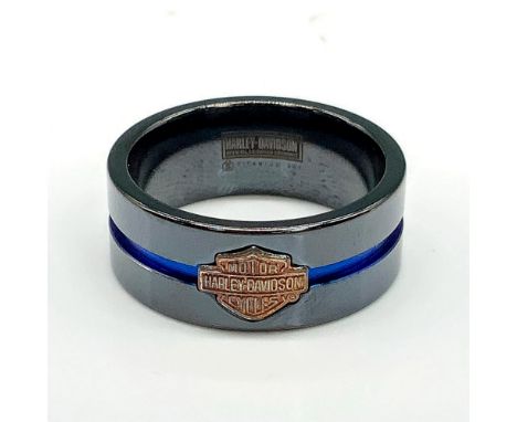 Black titanium band with a copper tone Harley Davidson logo and thin blue channel stripe around the middle. Titanium and 925 