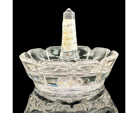 Clear pressed glass ring holder dish with flower pattern on the bottom. Issued: 1929-1939Dimensions: 2.5"H x 3"diaCondition: 